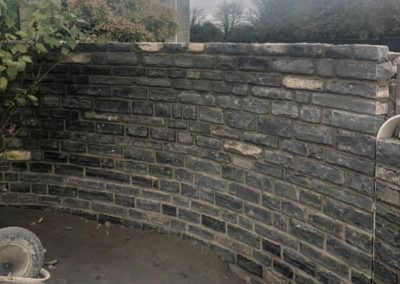 Curved stone wall